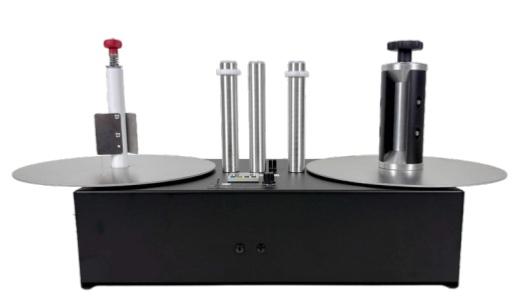 Label roll counter rewinder with quick release chuck